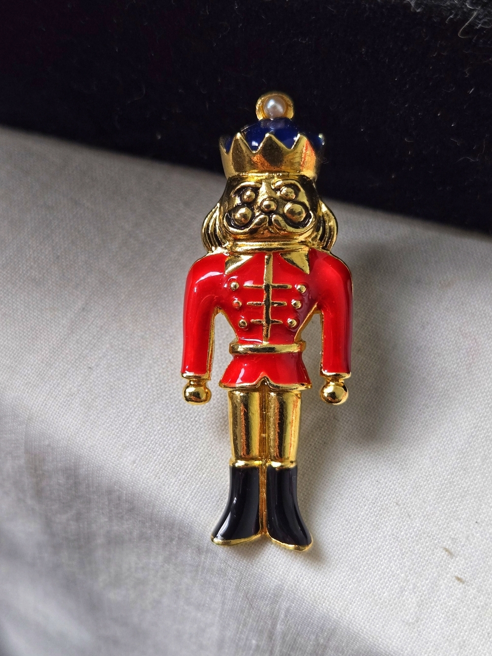 Avon 1997 Toy Soldier Pin Red and Gold Nutcracker Brooch with Blue Crown